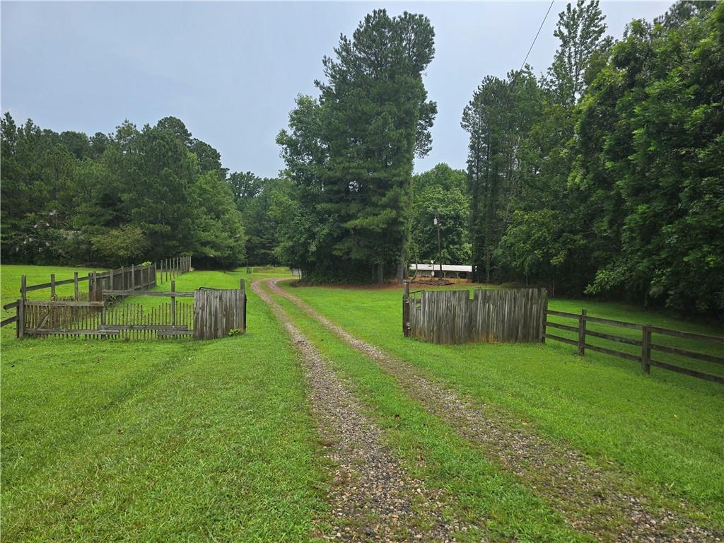 5725 Jot Em Down Road Cumming, GA 30041 - Photo 7 of 8 a view of a backyard with a slide