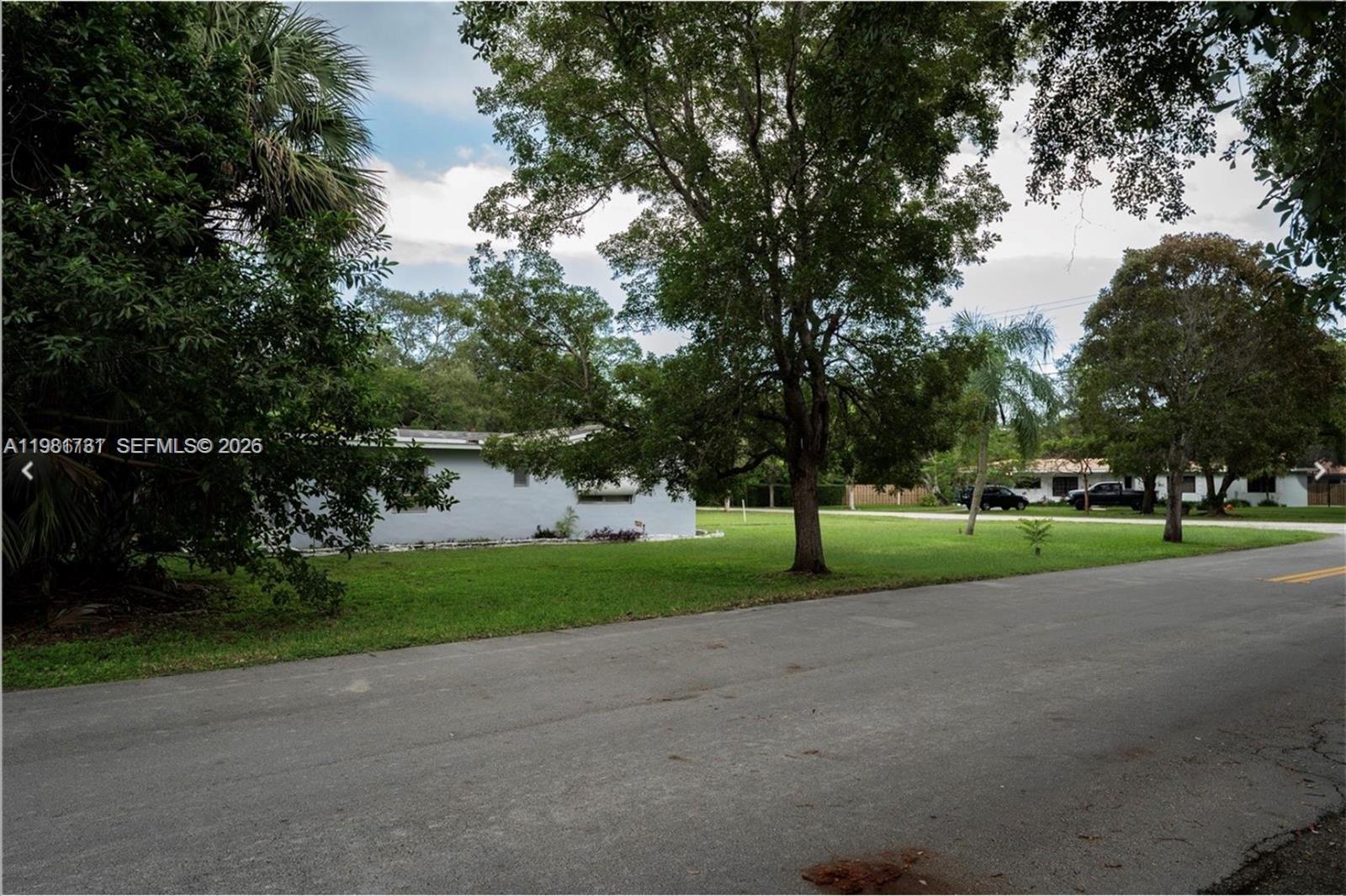 8045 Southwest 128th Street Pinecrest, FL 33156 - Photo 11 of 11 a view of road and trees