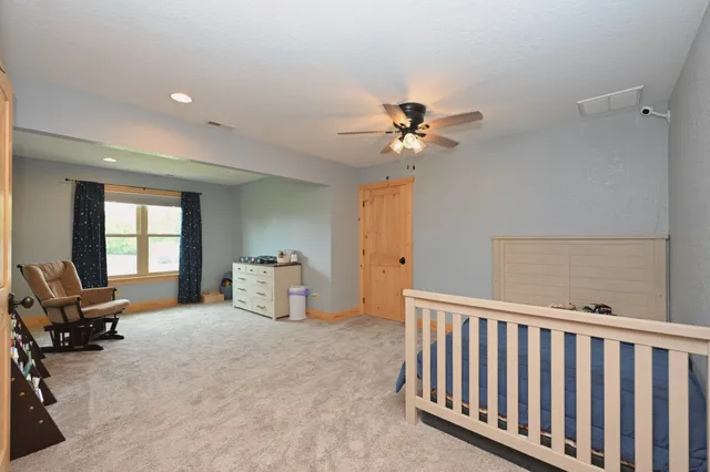 a view of a room with workspace and a window