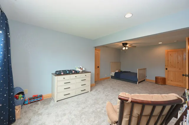 a bathroom with a granite countertop sink mirror and shower