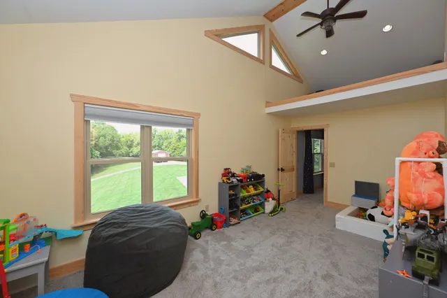 a view of a roof deck with table and chairs a barbeque with wooden floor and fence