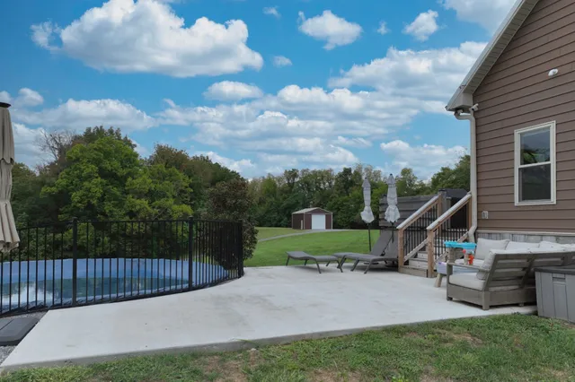 a backyard of a house with lots of green space
