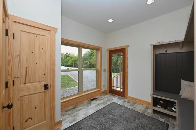 a view of an empty room with a window