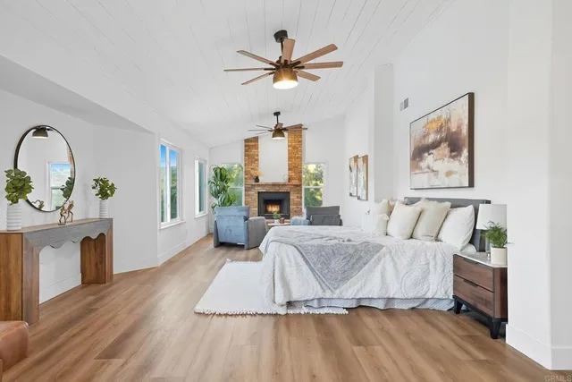 a bed room with a bed and a chandelier