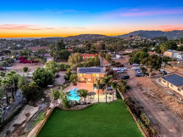 a kitchen with stainless steel appliances granite countertop a sink and a stove