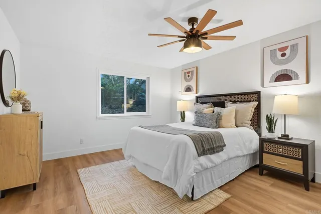 a bathroom with a double vanity sink toilet and shower