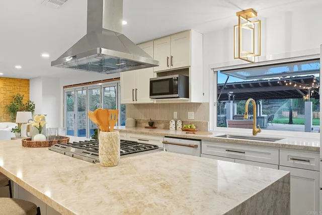 a kitchen with a sink and a stove