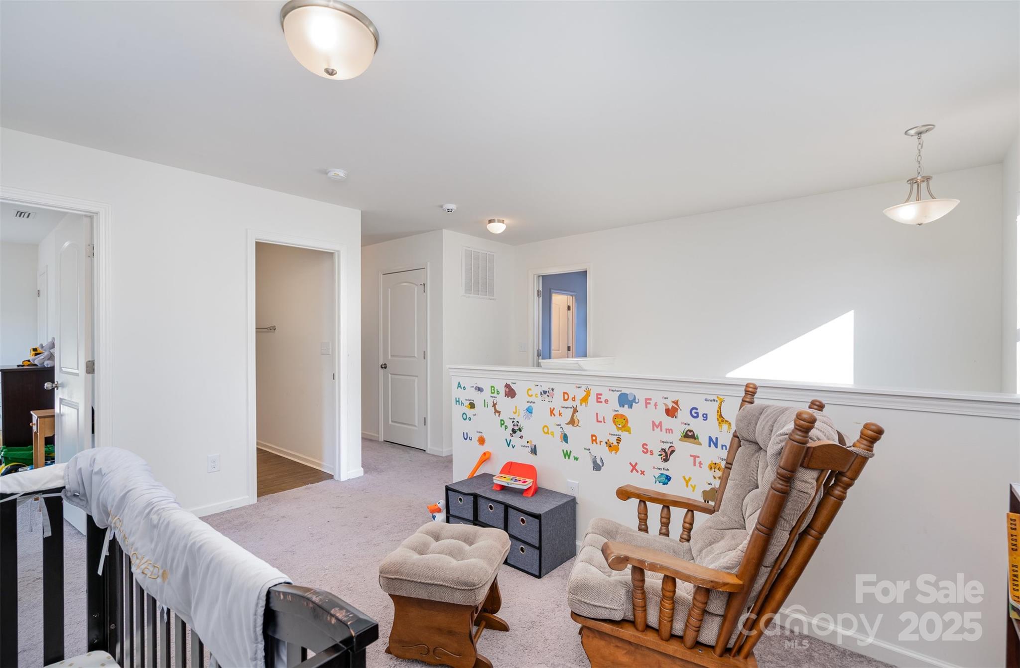 8009 Camden Crossing Lowell, NC 28098 - Photo 11 of 20 a living room with furniture and a table