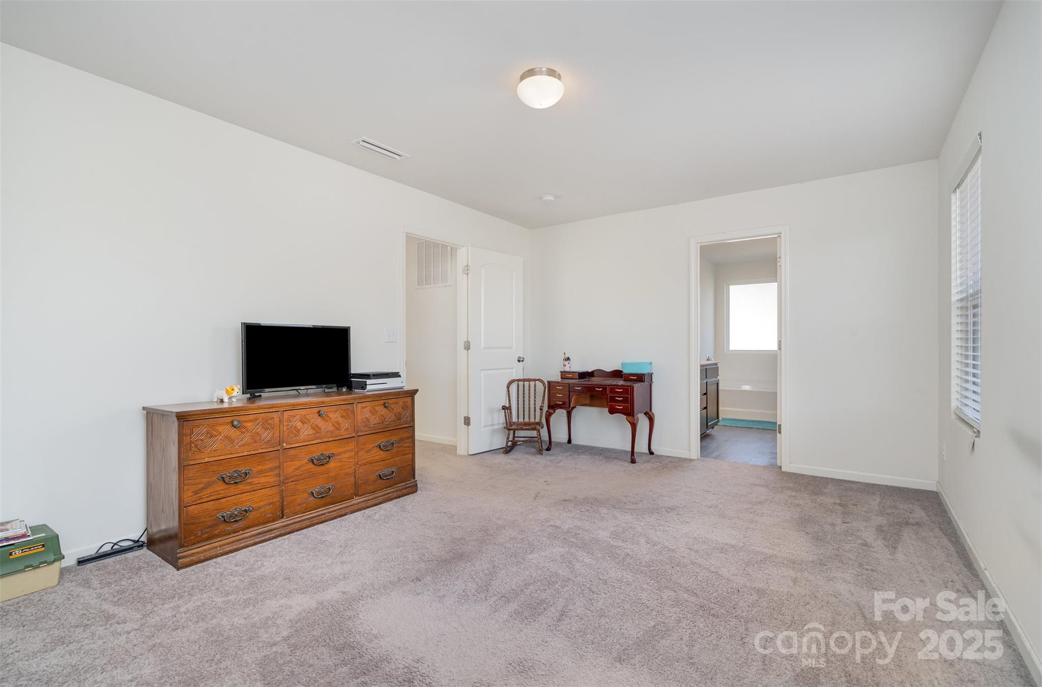 8009 Camden Crossing Lowell, NC 28098 - Photo 12 of 20 a living room with furniture and a flat screen tv