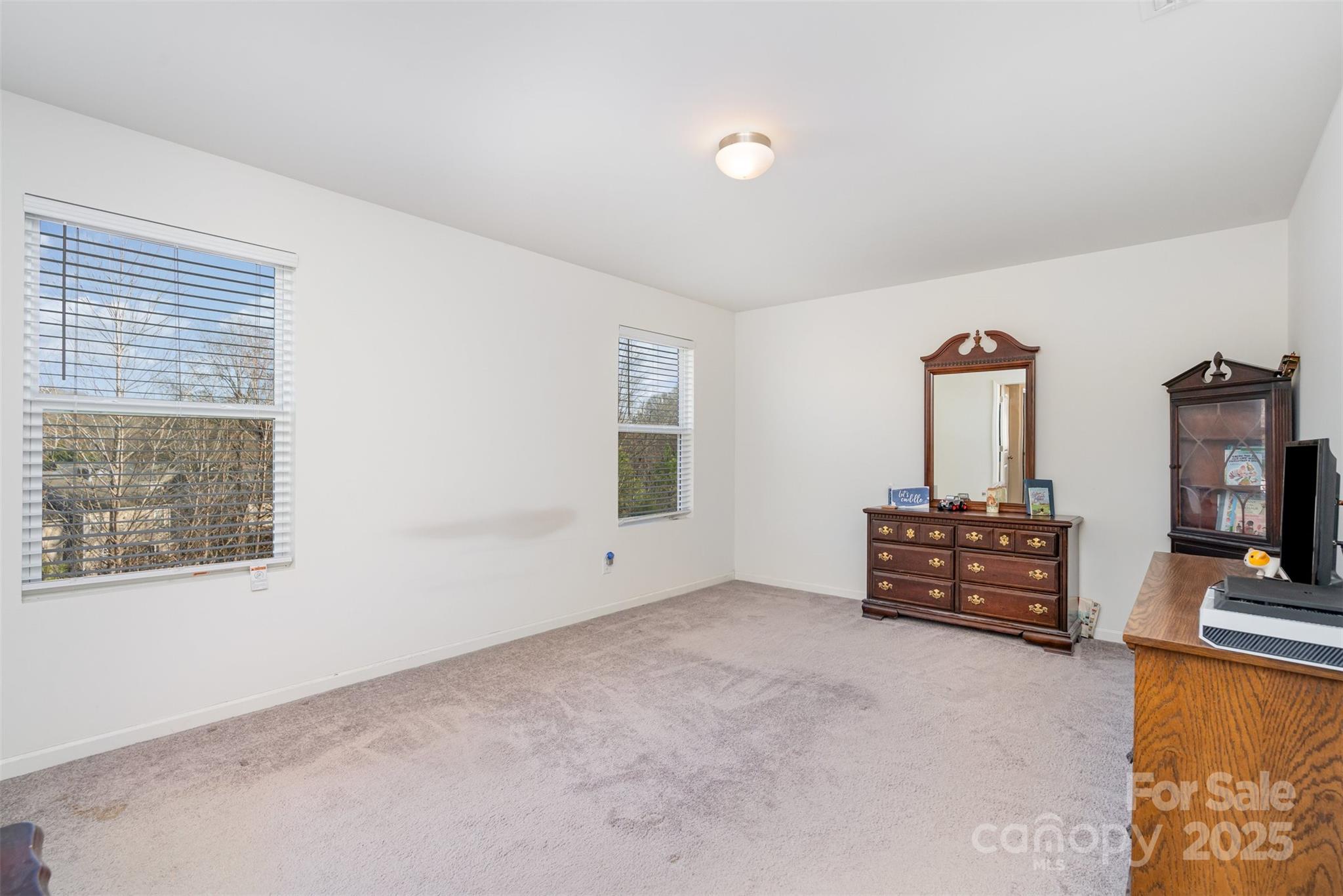 8009 Camden Crossing Lowell, NC 28098 - Photo 13 of 20 a view of workspace with furniture and flat screen tv