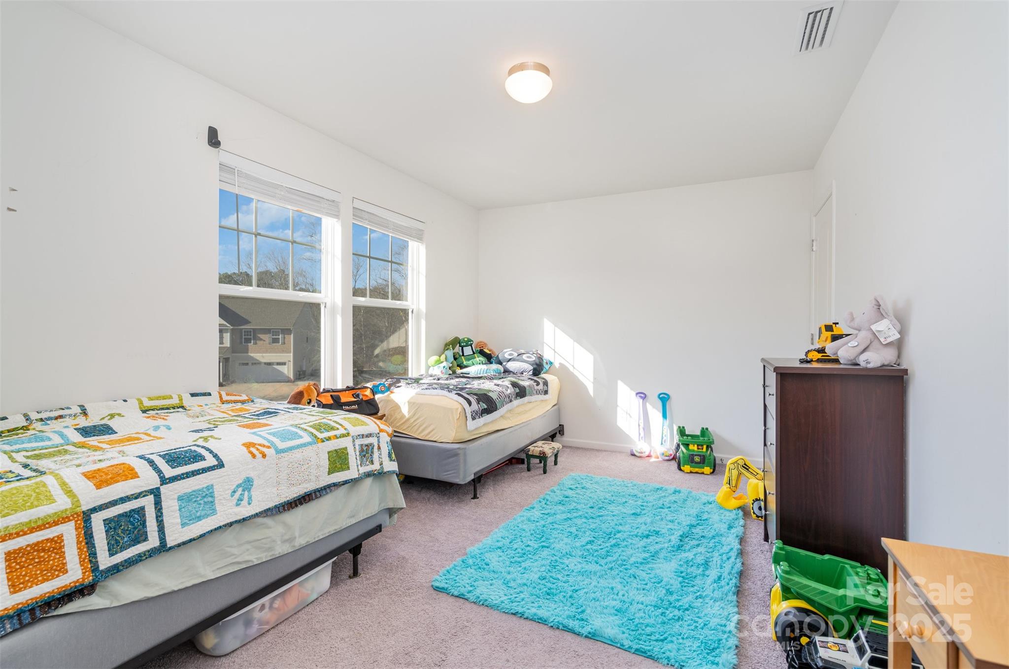 8009 Camden Crossing Lowell, NC 28098 - Photo 15 of 20 a bedroom with bed and a window