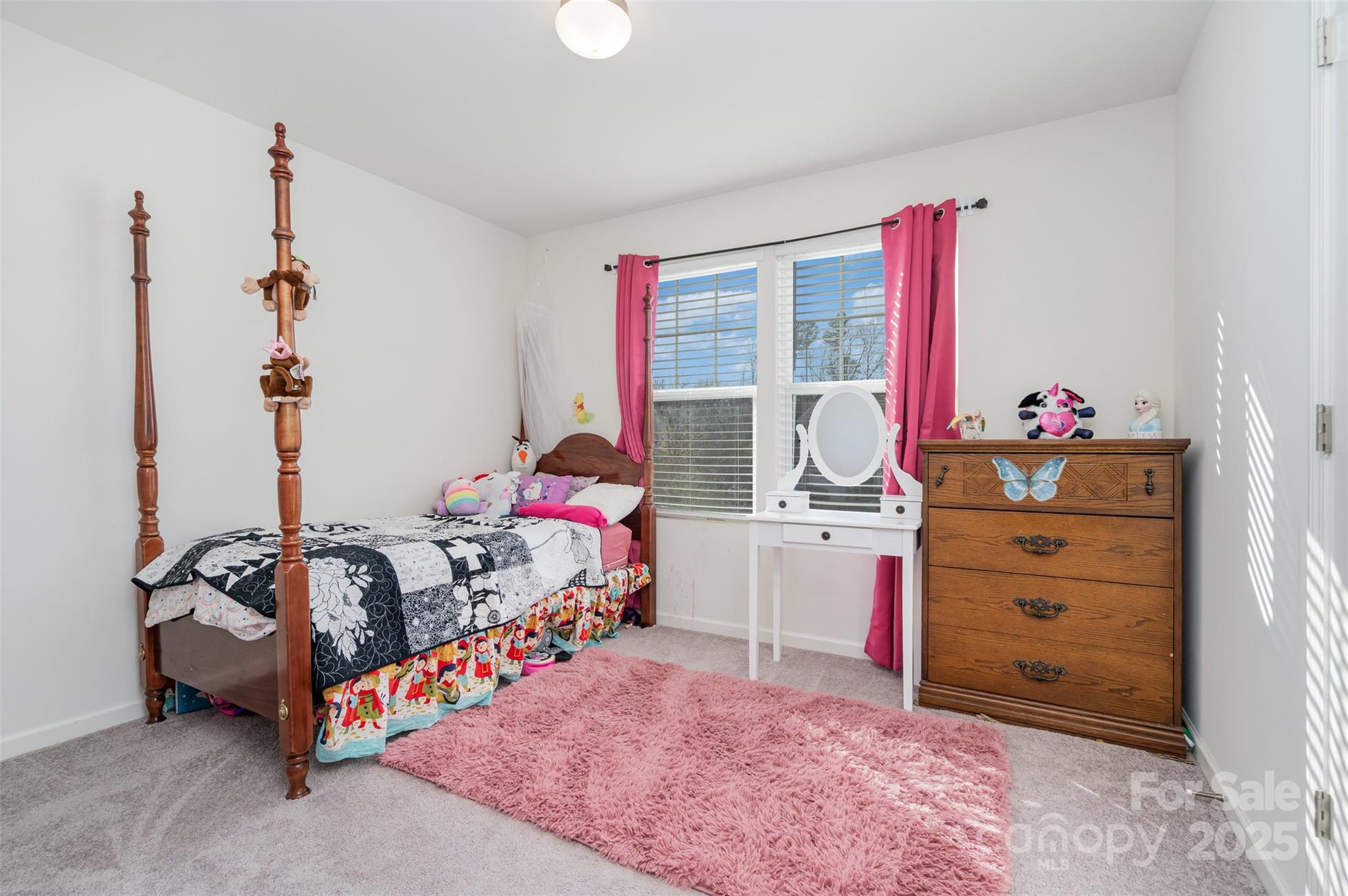 8009 Camden Crossing Lowell, NC 28098 - Photo 17 of 20 a bedroom with a bed and a window