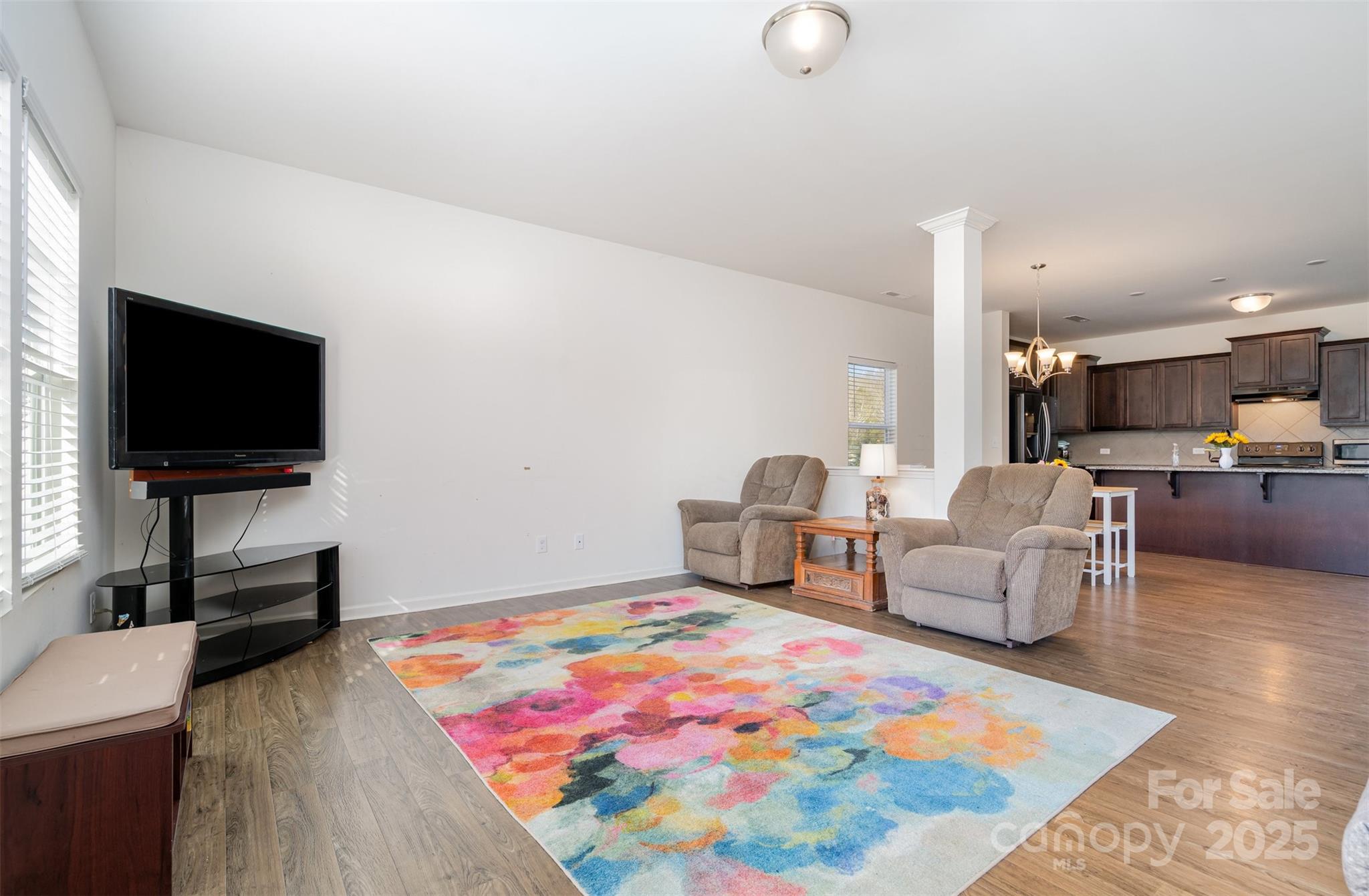 8009 Camden Crossing Lowell, NC 28098 - Photo 3 of 20 a living room with furniture and a flat screen tv