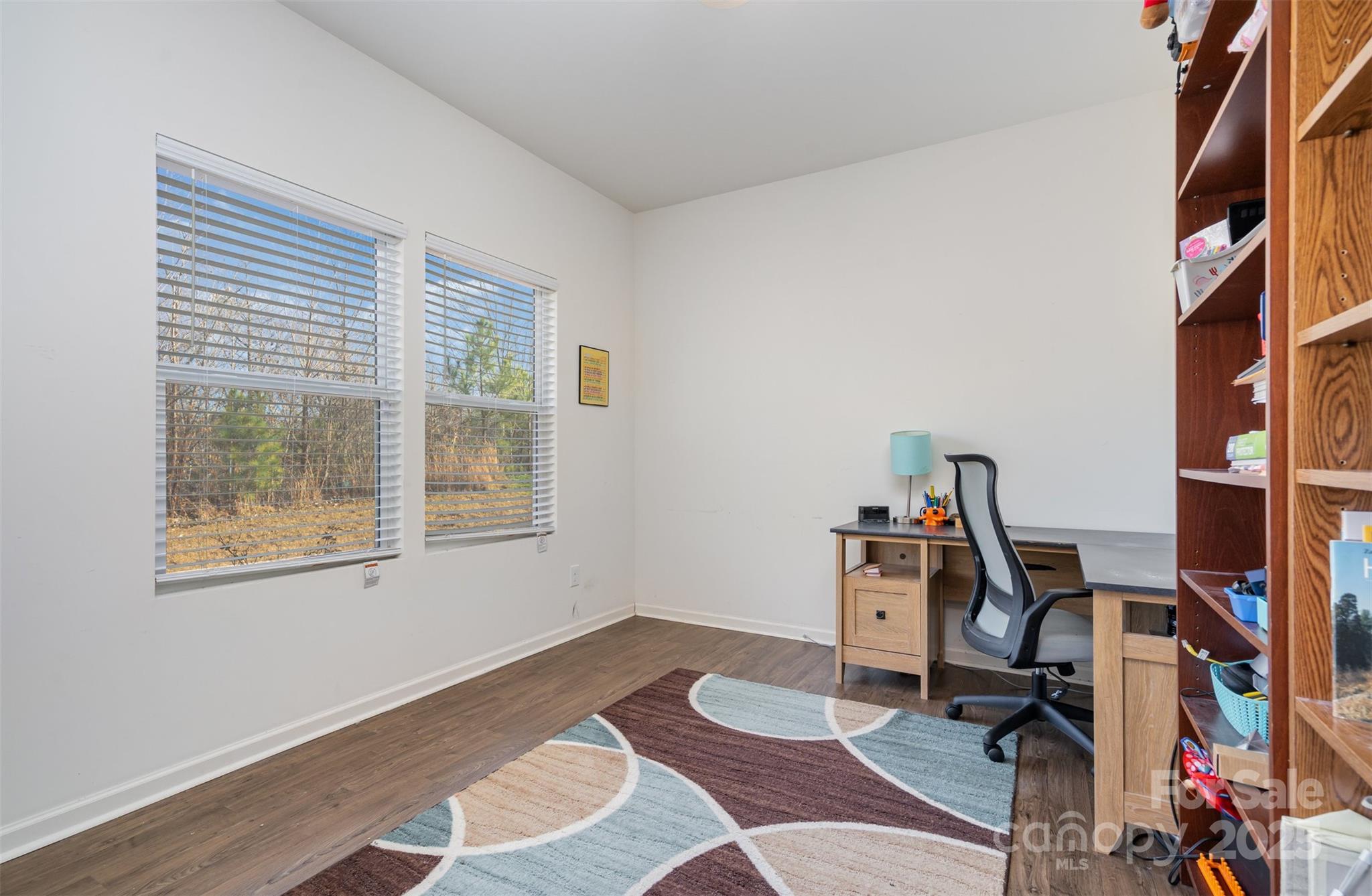8009 Camden Crossing Lowell, NC 28098 - Photo 9 of 20 a view of a workspace with furniture and a window