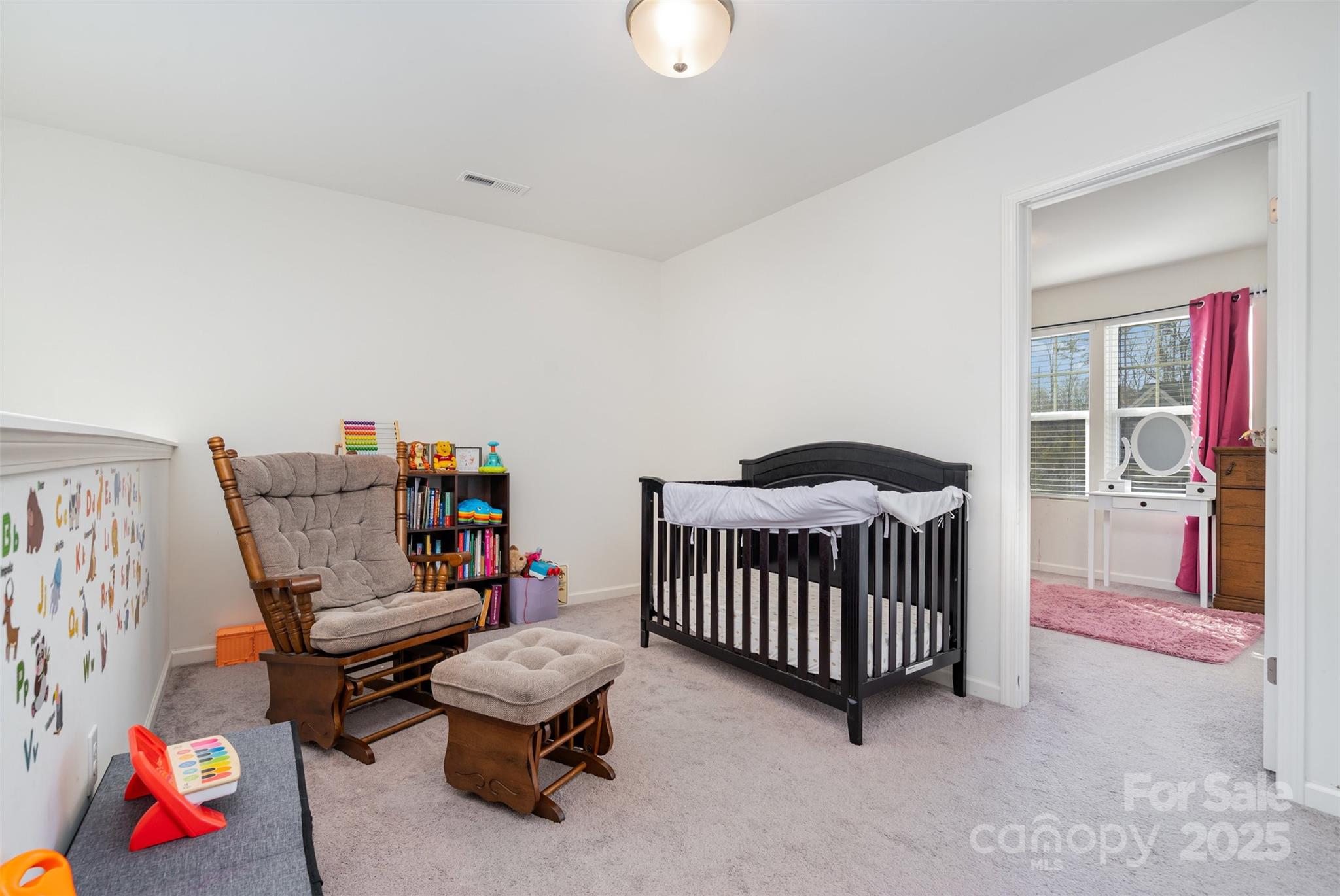 8009 Camden Crossing Lowell, NC 28098 - Photo 10 of 20 a bedroom with furniture and a rug