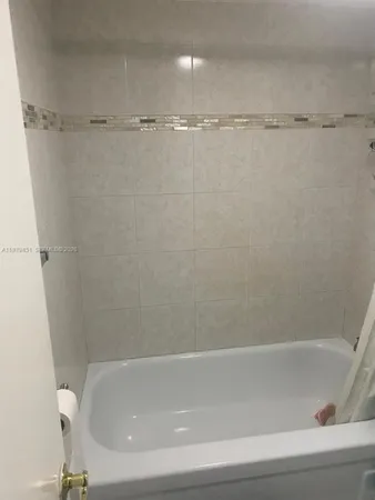 a close view of a bathtub in bathroom