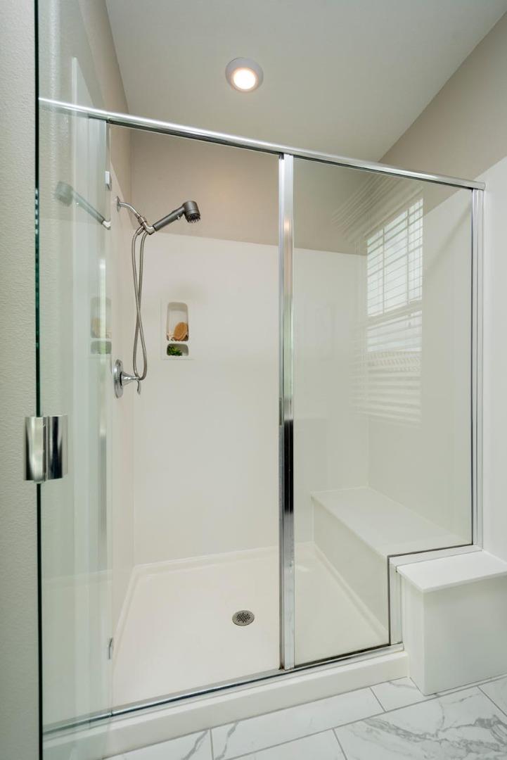24252 Nora Circle Hayward, CA 94545 - Photo 24 of 51 a bathroom with a glass shower door