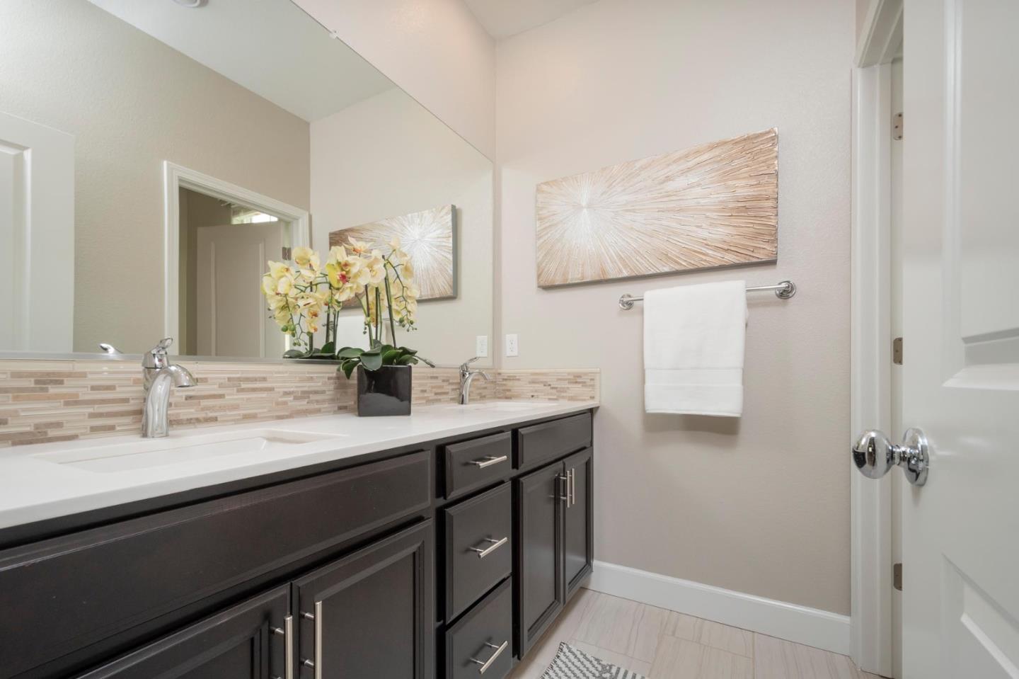 24252 Nora Circle Hayward, CA 94545 - Photo 27 of 51 a bathroom with a double vanity sink a mirror and a shower