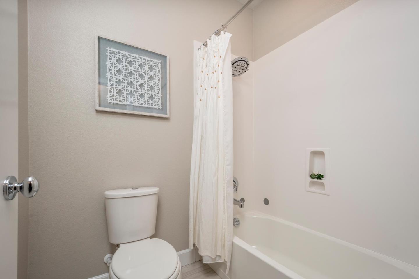 24252 Nora Circle Hayward, CA 94545 - Photo 28 of 51 a white toilet sitting next to a bath tub