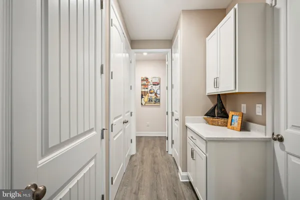 a view of a kitchen from the hallway