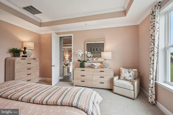 a bedroom with a bed and furniture