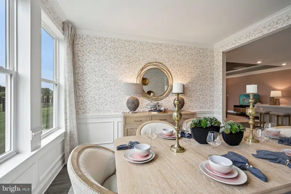 a room with furniture and a potted plant