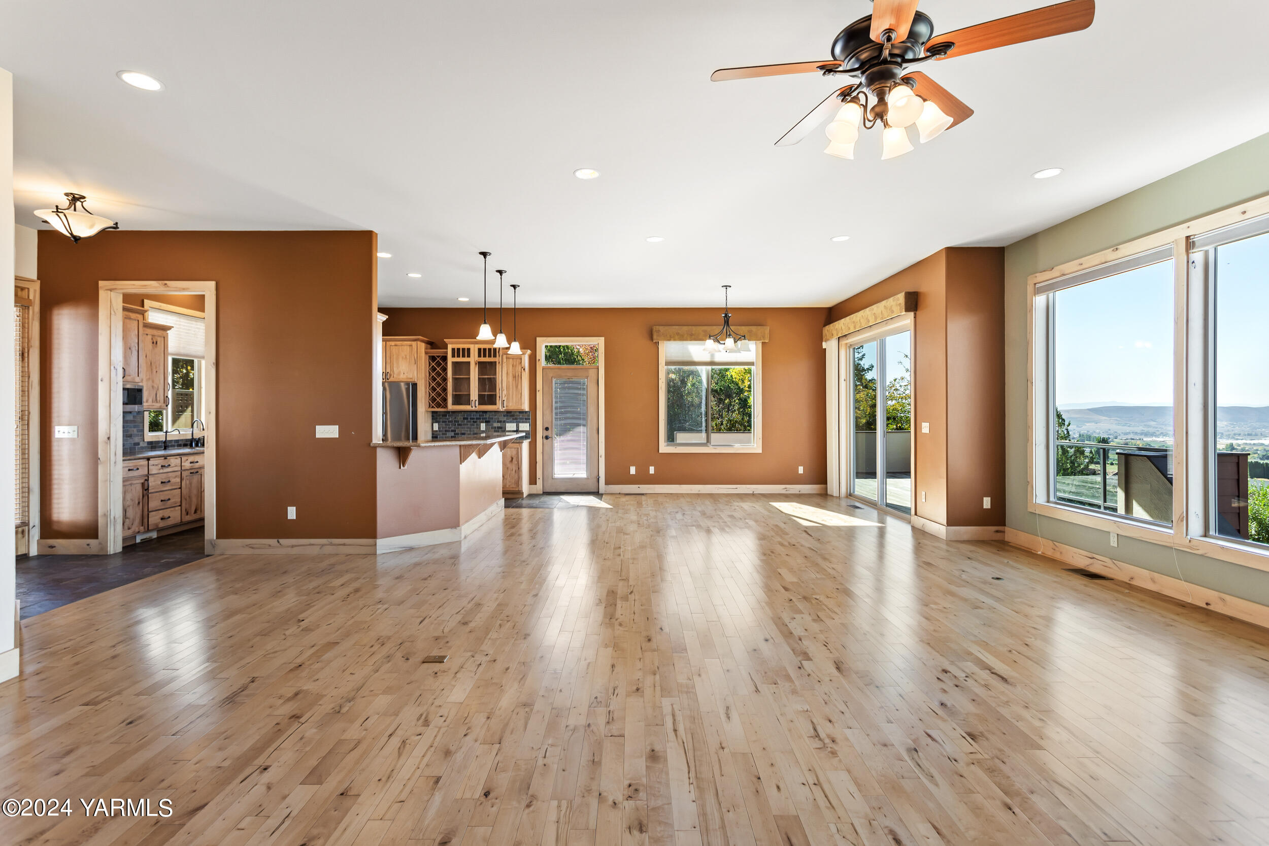 950 St Hilaire Road Yakima, WA 98901 - Photo 6 of 55 wooden floor in an empty room with a window
