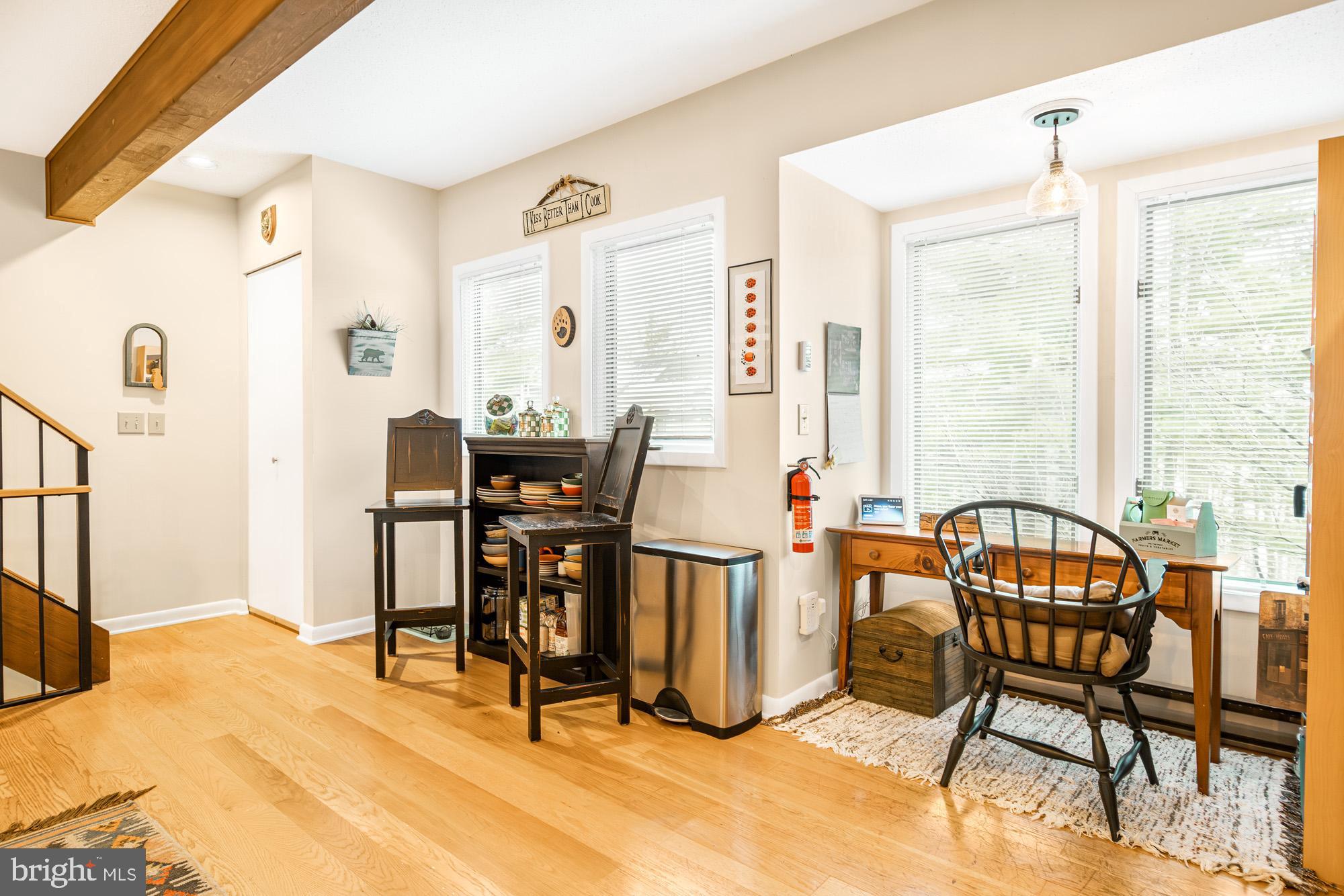 6 Winding Way, Unit 19C McHenry, MD 21541 - Photo 17 of 62 a view of a dining room with furniture and a window