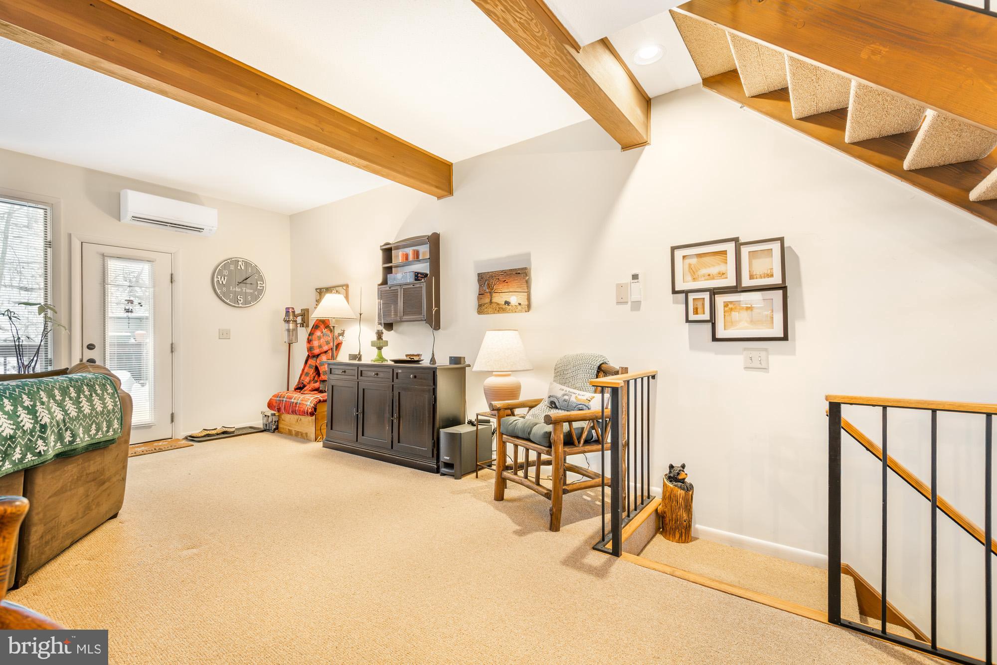 6 Winding Way, Unit 19C McHenry, MD 21541 - Photo 19 of 62 a bedroom with furniture and a large window