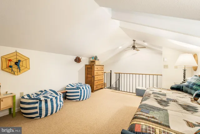 a bed room with a bed and a lamp