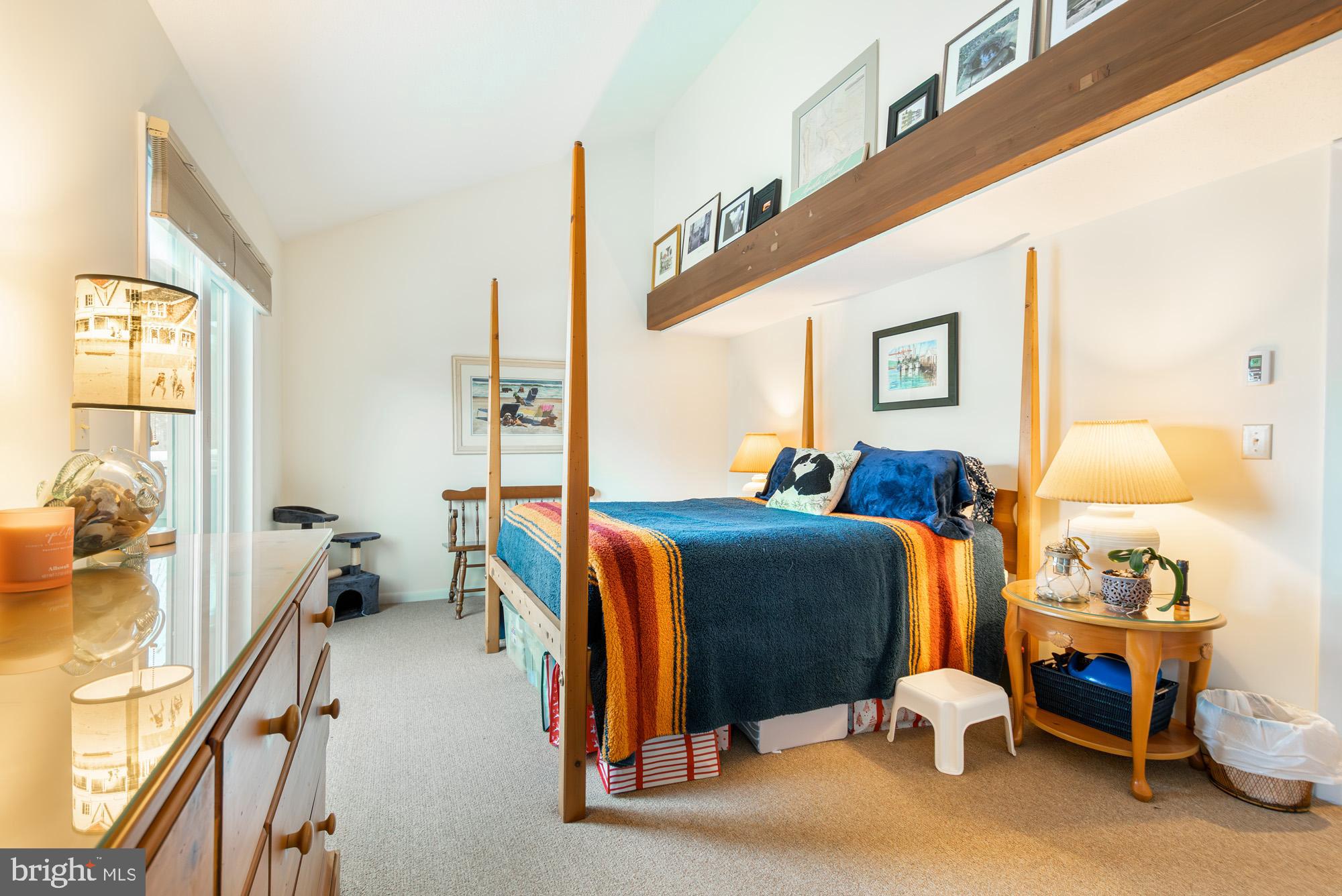 6 Winding Way, Unit 19C McHenry, MD 21541 - Photo 28 of 62 a bed room with a bed and a lamp