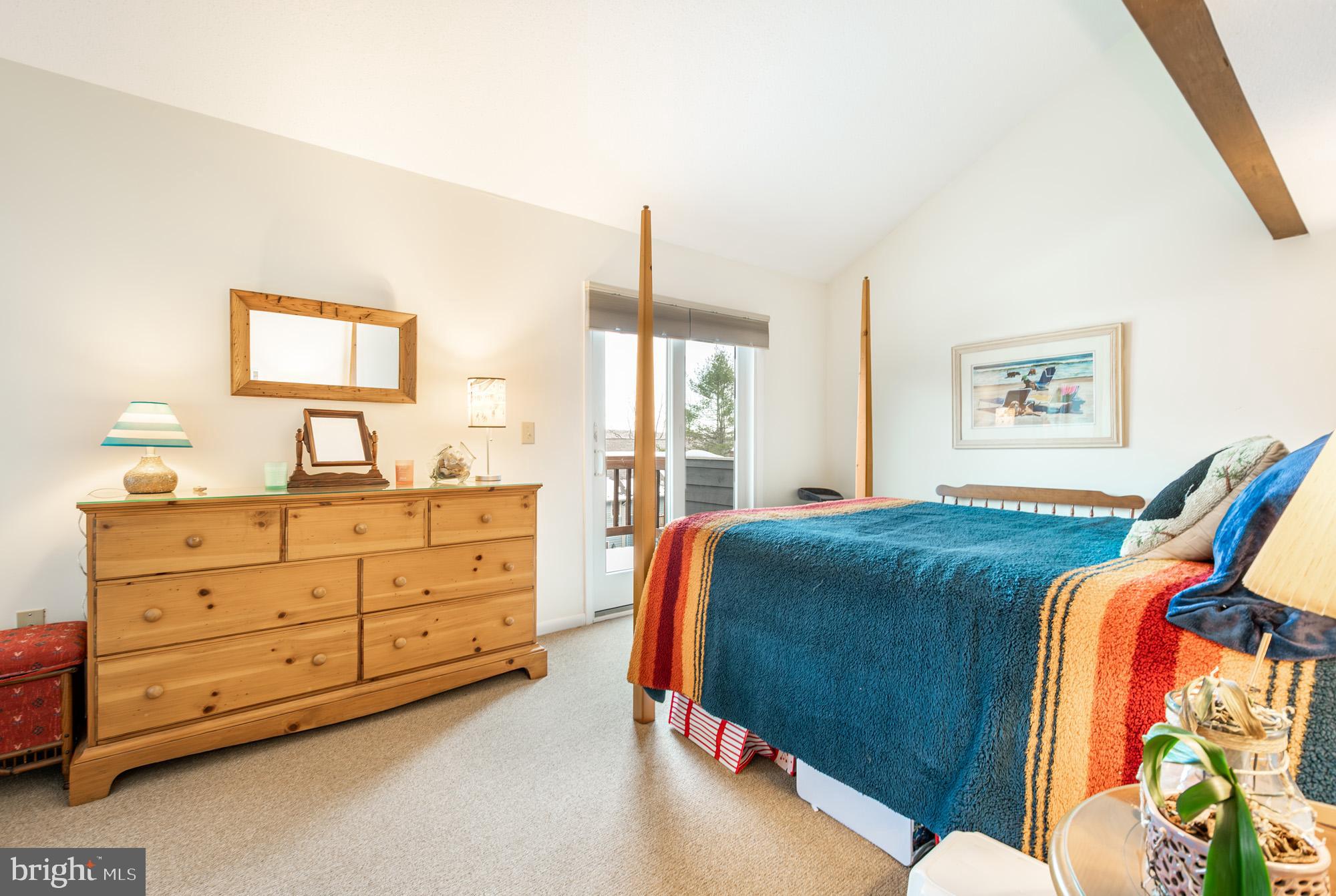 6 Winding Way, Unit 19C McHenry, MD 21541 - Photo 29 of 62 a bedroom with a bed and a dresser