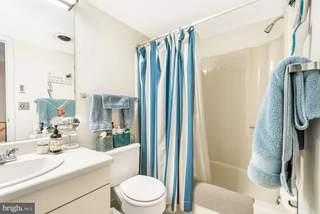 a utility room with sink dryer and washer