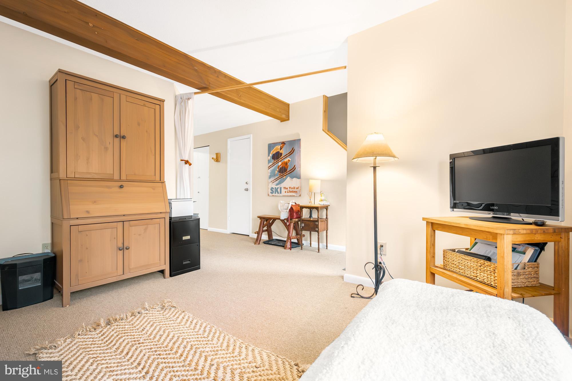 6 Winding Way, Unit 19C McHenry, MD 21541 - Photo 33 of 62 a bedroom with furniture and a flat screen tv