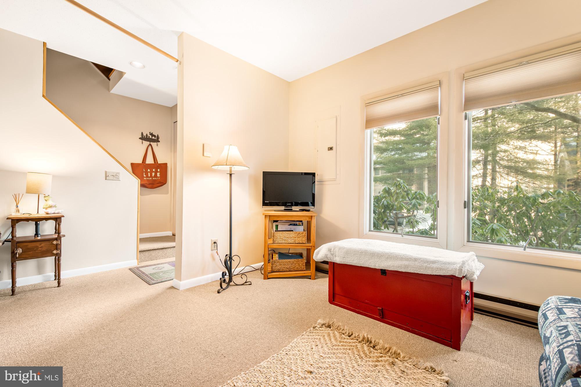 6 Winding Way, Unit 19C McHenry, MD 21541 - Photo 34 of 62 a bedroom with a bed and large window