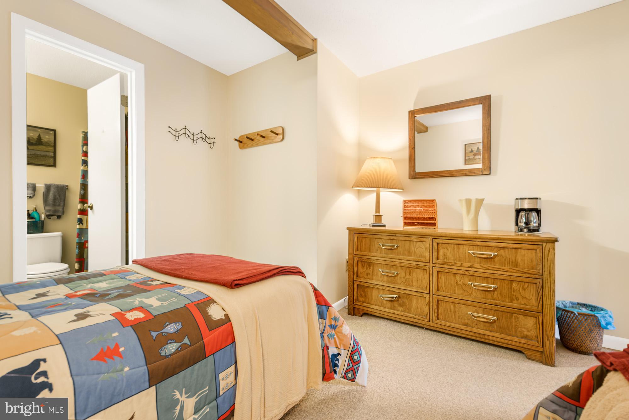 6 Winding Way, Unit 19C McHenry, MD 21541 - Photo 39 of 62 a bedroom with a bed and a dresser