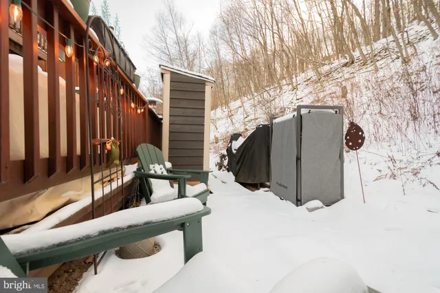 a view of a table and chairs under an umbrella