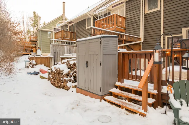 a view of a chair and table under an umbrella