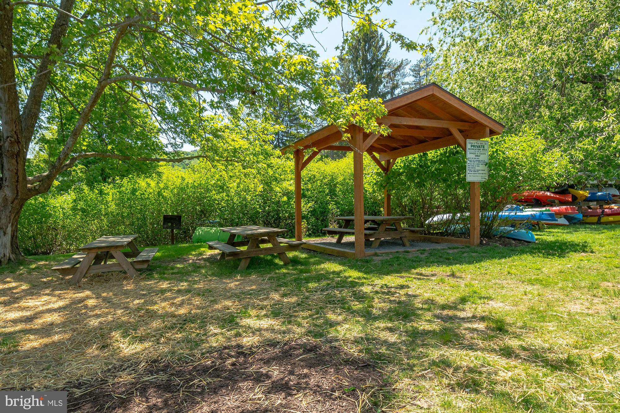 6 Winding Way, Unit 19C McHenry, MD 21541 - Photo 59 of 62 a view of a chair and table under an umbrella