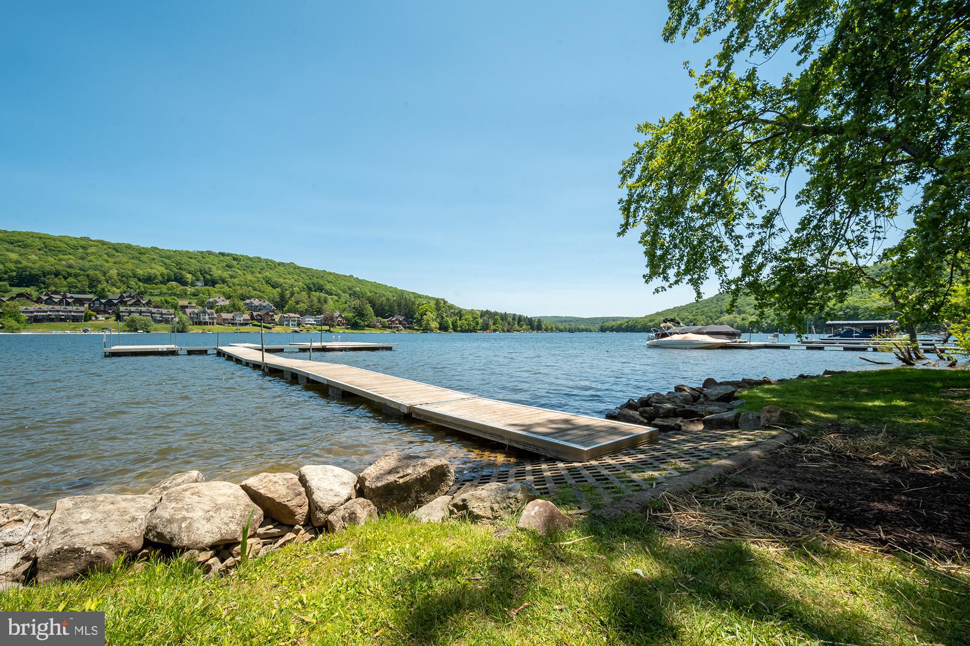 6 Winding Way, Unit 19C McHenry, MD 21541 - Photo 60 of 62 a view of a lake with trees by side of it