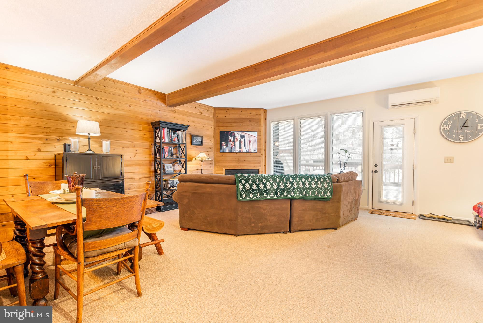 6 Winding Way, Unit 19C McHenry, MD 21541 - Photo 10 of 62 a living room with furniture a flat screen tv and a table