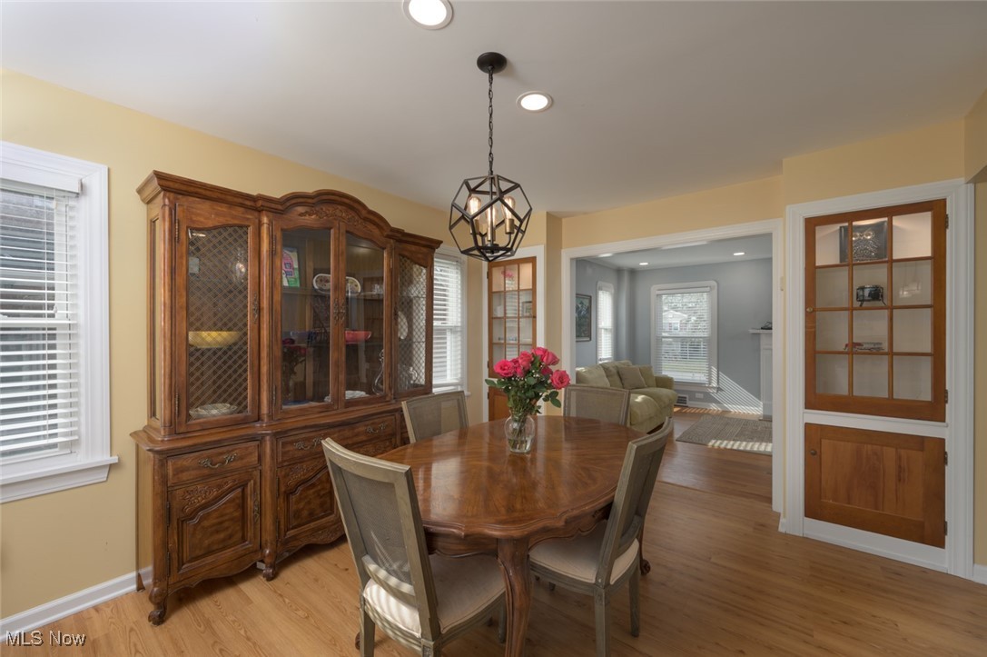 4037 Riveredge Road Cleveland, OH 44111 - Photo 12 of 30 Dining area featuring a chandelier and light hardwood / wood-style floors