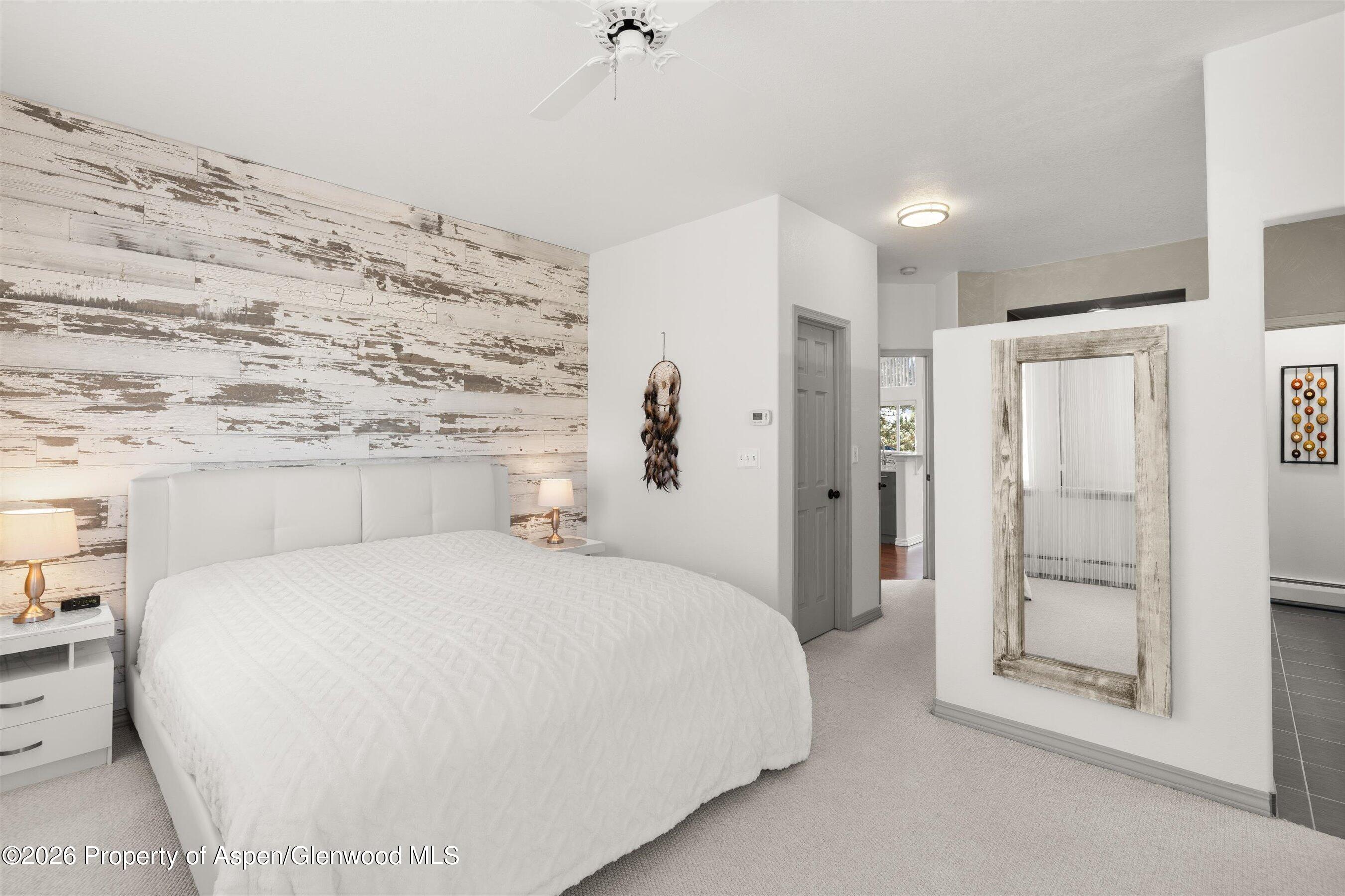 1 Pine Ridge Road Basalt, CO 81621 - Photo 14 of 32 a bedroom with a bed and a mirror