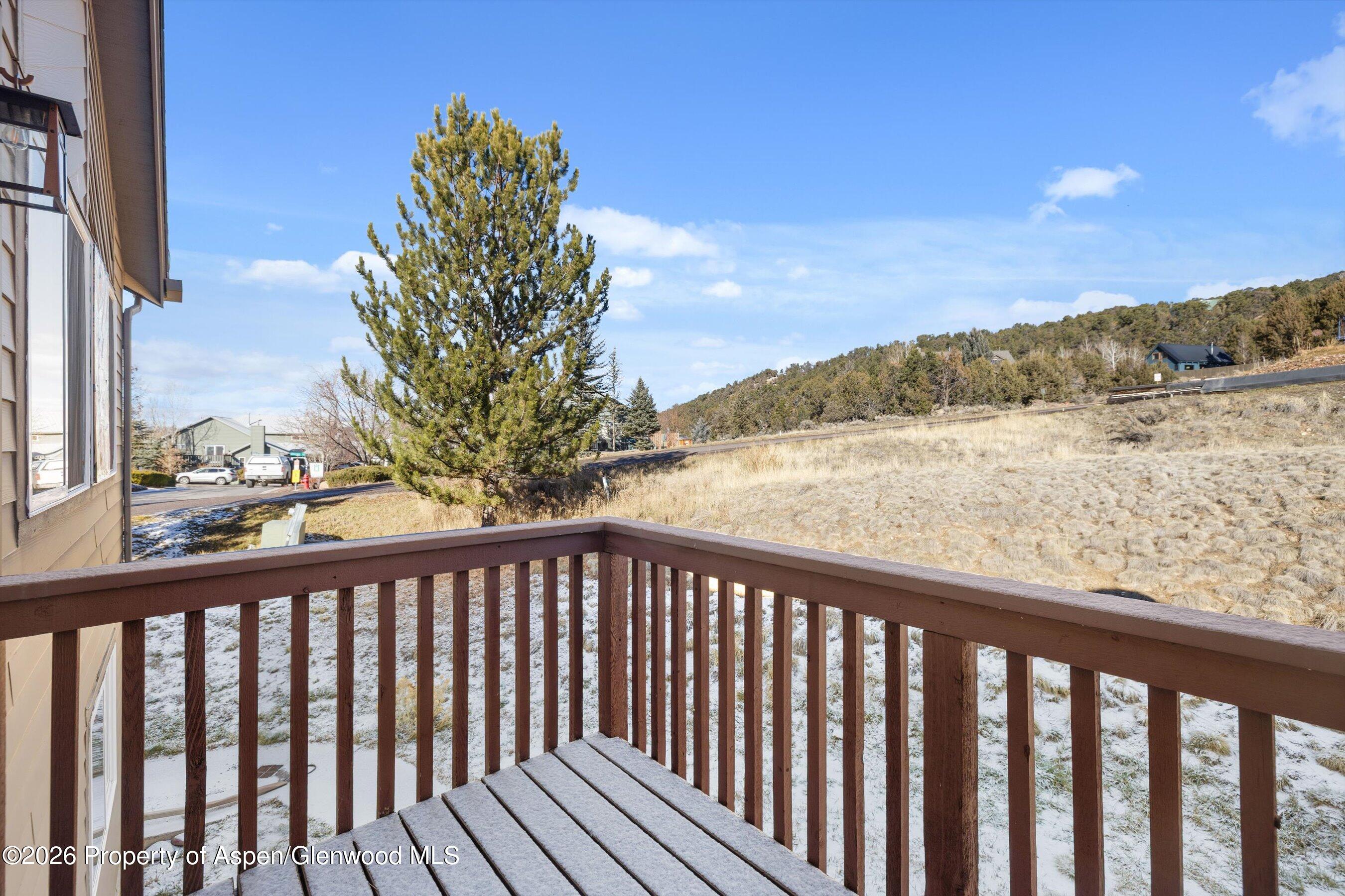 1 Pine Ridge Road Basalt, CO 81621 - Photo 19 of 32 a view of a balcony with wooden fence and floor