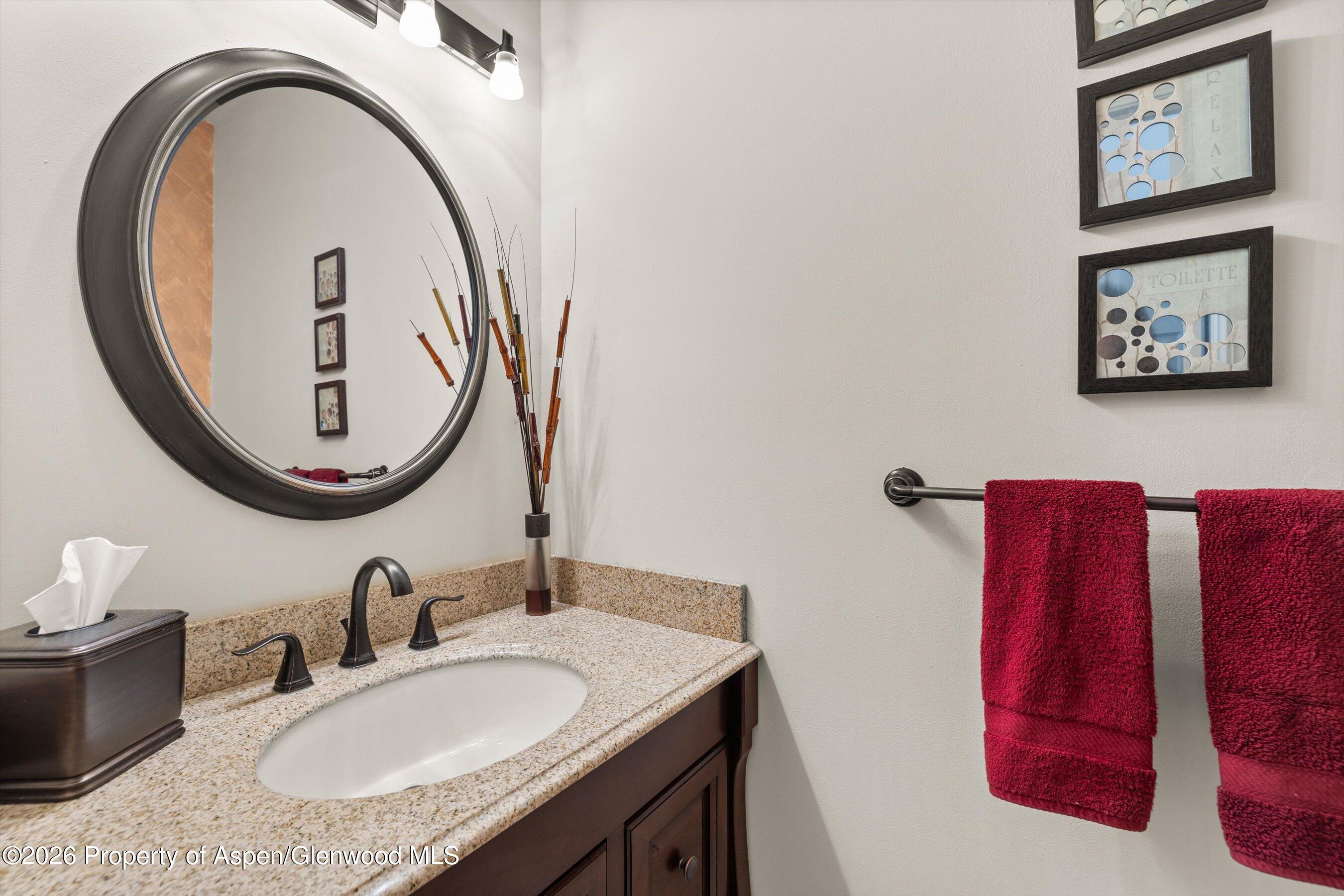 1 Pine Ridge Road Basalt, CO 81621 - Photo 20 of 32 a bathroom with a granite countertop sink and a mirror