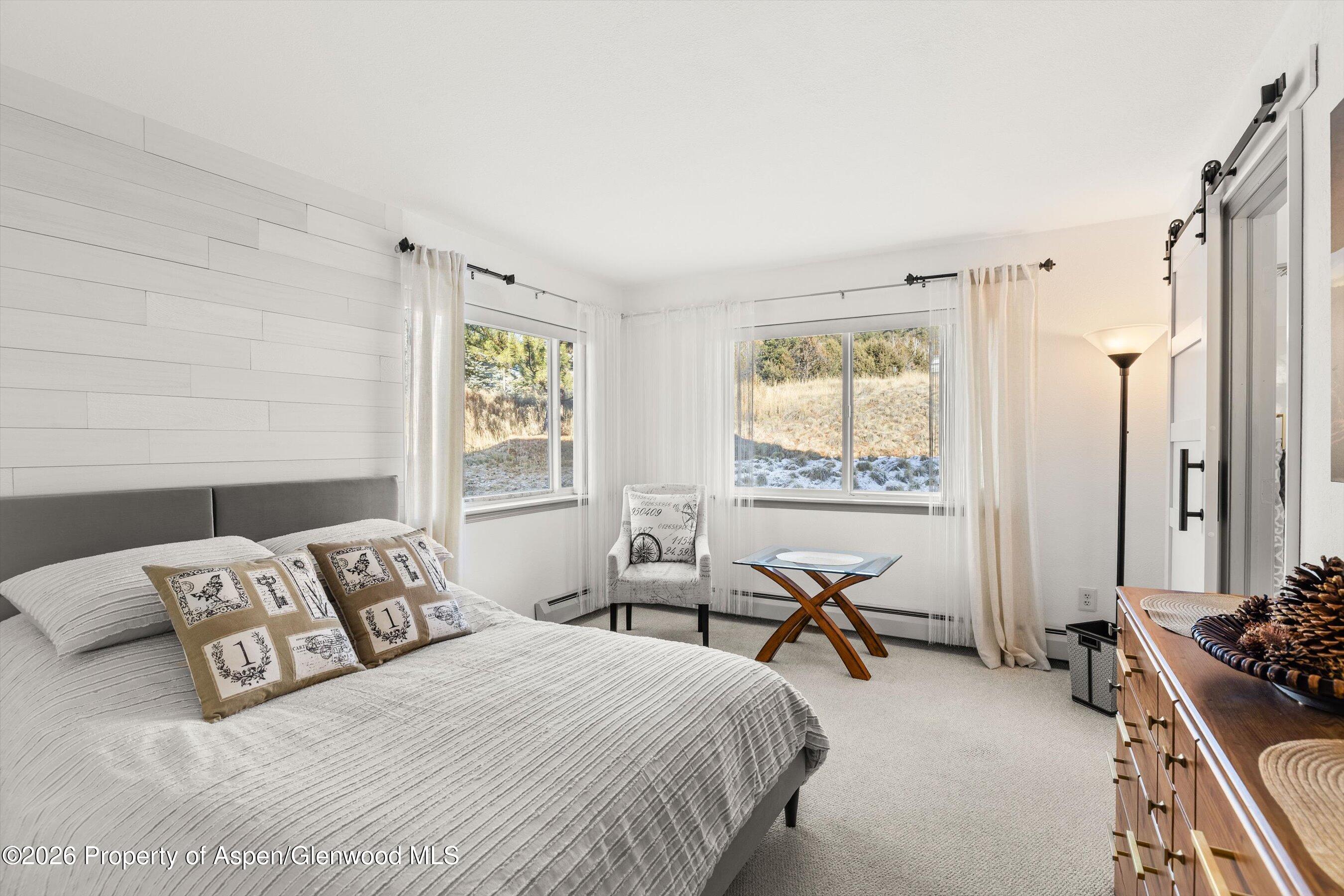 1 Pine Ridge Road Basalt, CO 81621 - Photo 21 of 32 a bedroom with two beds and a large window