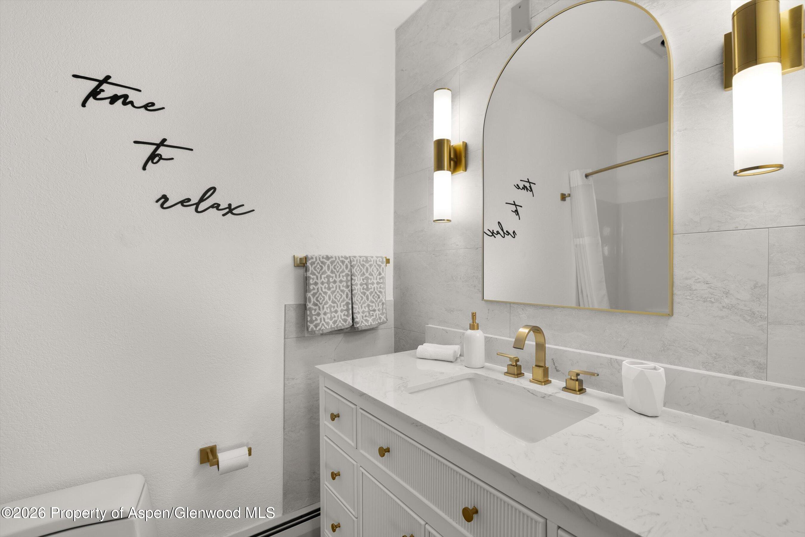 1 Pine Ridge Road Basalt, CO 81621 - Photo 24 of 32 a bathroom with a sink and a mirror