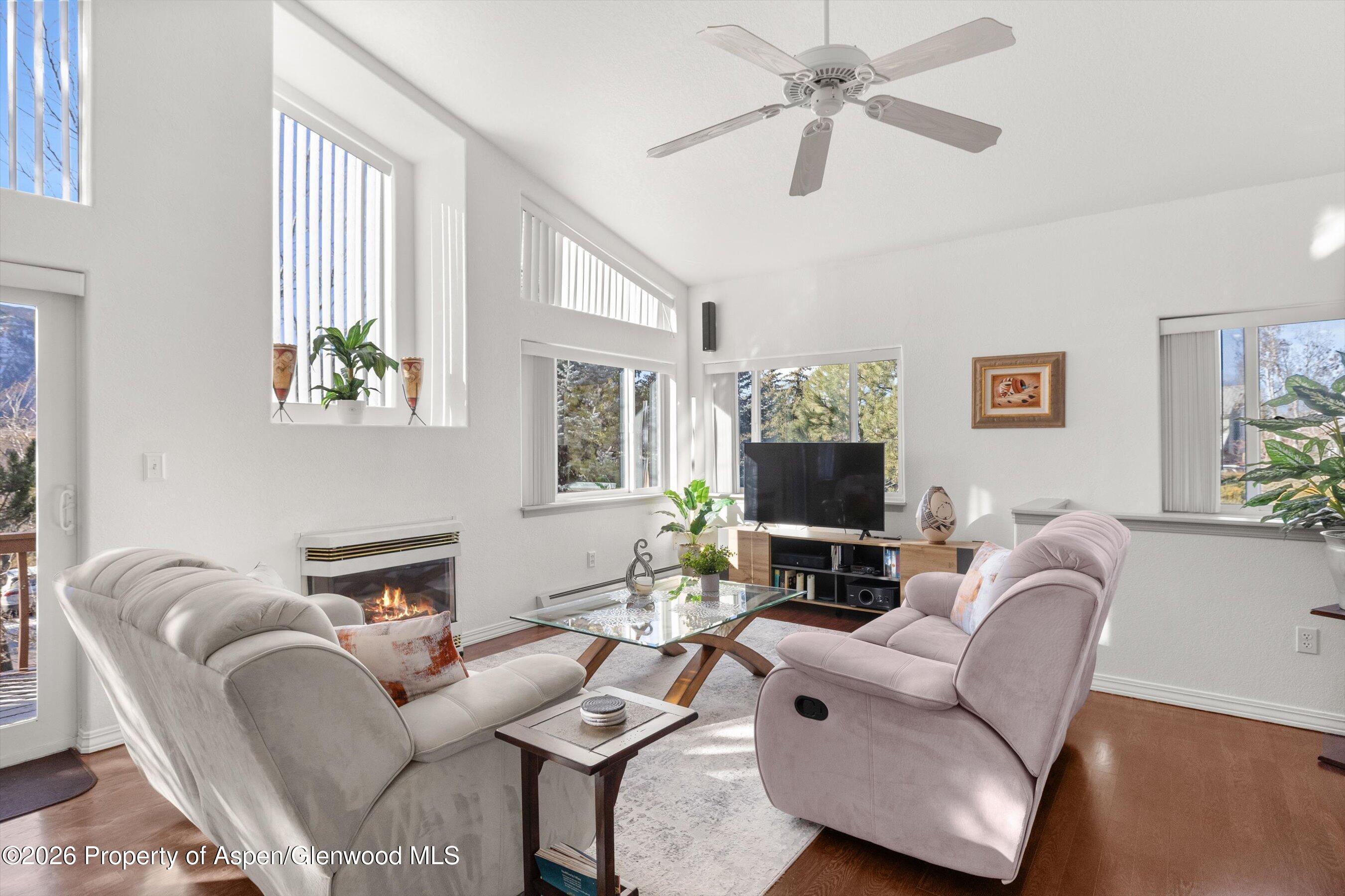 1 Pine Ridge Road Basalt, CO 81621 - Photo 7 of 32 a living room with furniture a fireplace and a flat screen tv