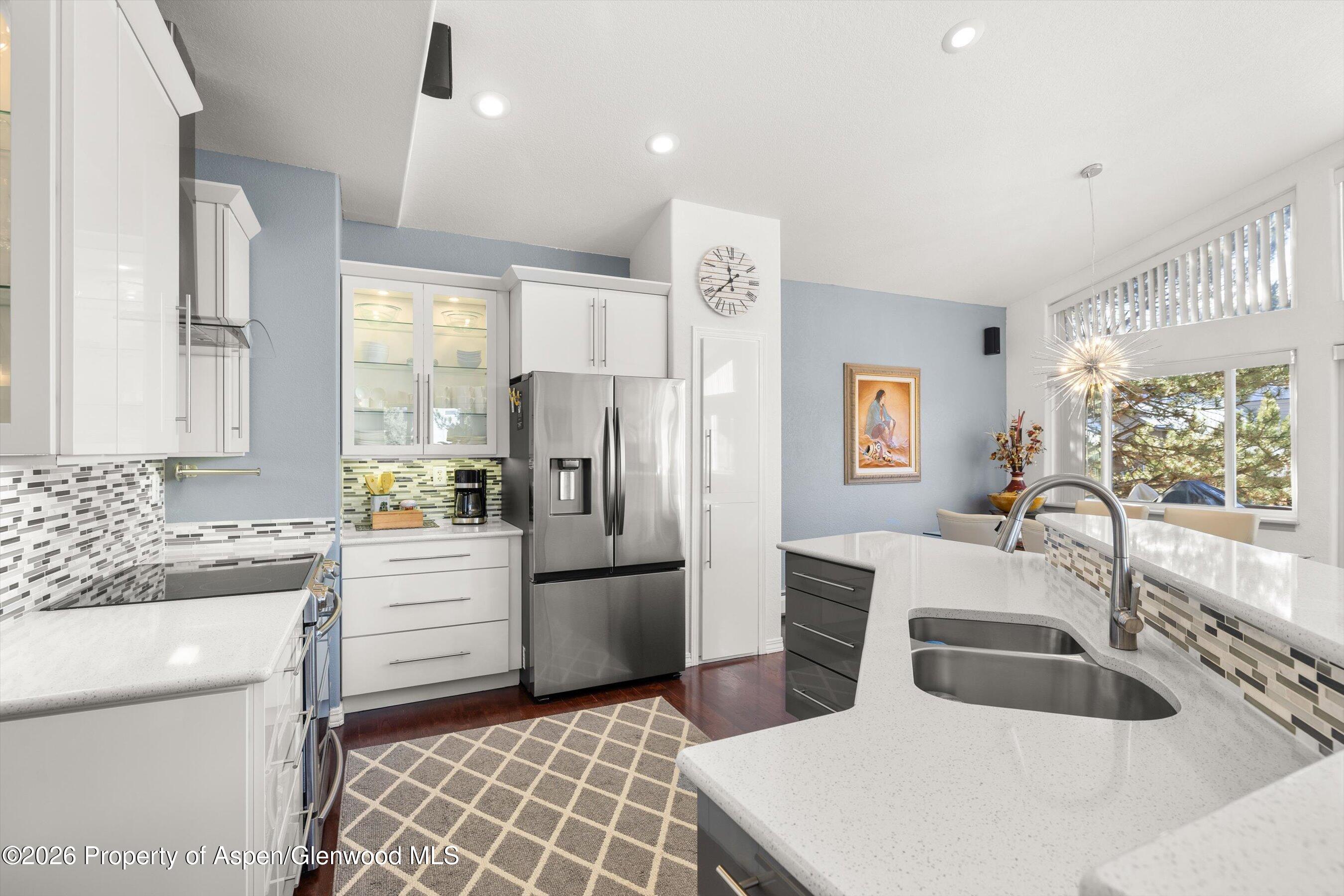 1 Pine Ridge Road Basalt, CO 81621 - Photo 8 of 32 a kitchen with stainless steel appliances a refrigerator sink and cabinets