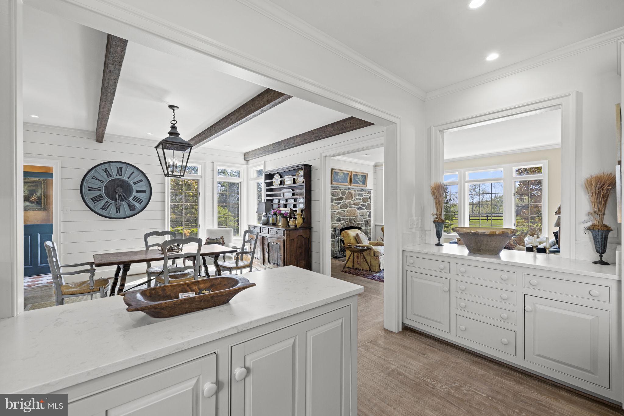 36190 Turkey Roost Road Middleburg, VA 20117 - Photo 25 of 88 a view of a kitchen area with furniture and a large window